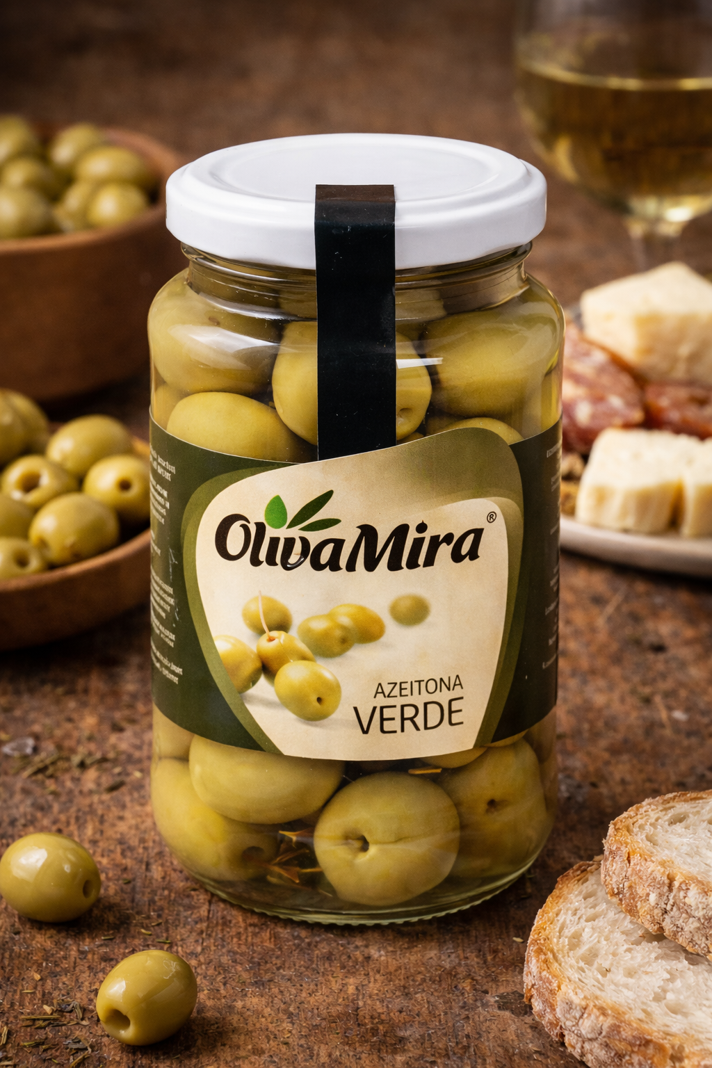OlivaMira whole green olives served with Portuguese cheese, bread and charcuterie